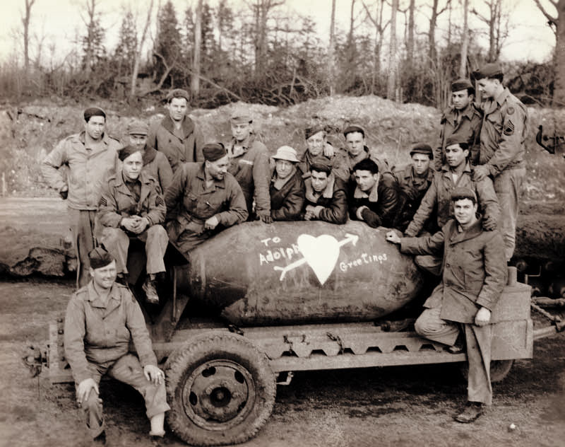 crew with bomb, writing on it to send a message to Hitler